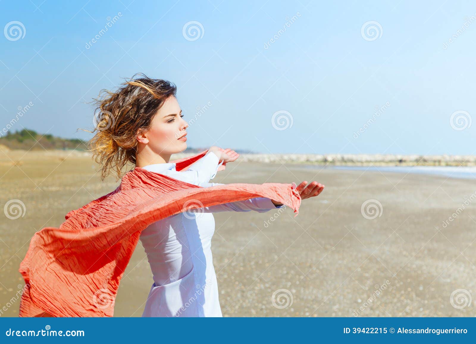 young female with red scarf on the beach