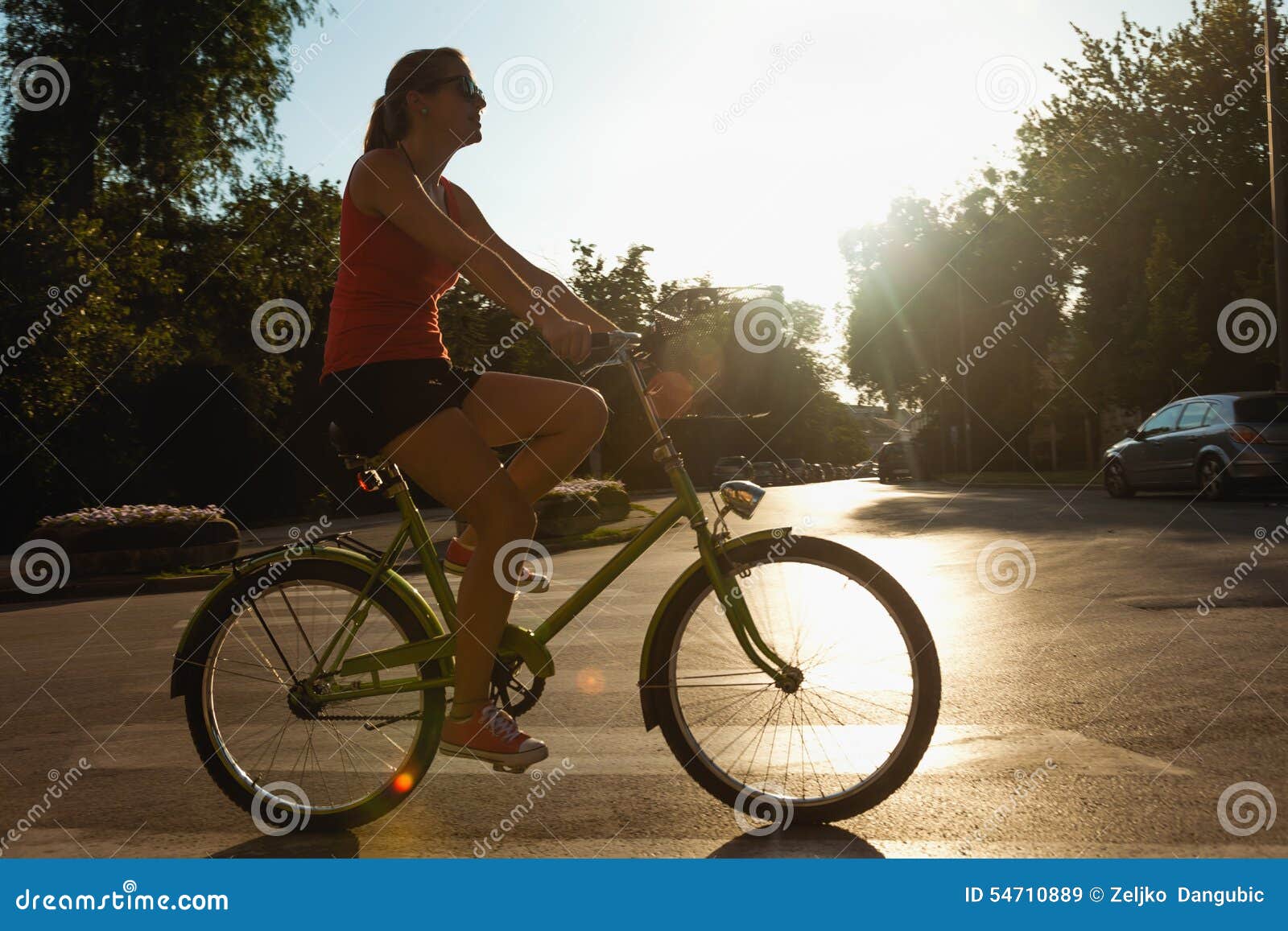 young female riding bike