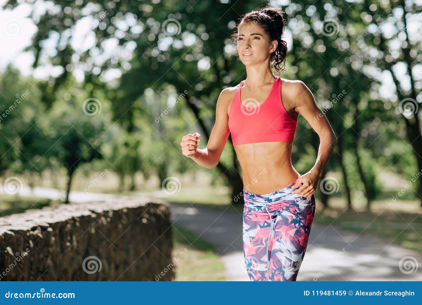 Young Female Runner Jogging during Outdoor Workout in a Park. Beautiful ...