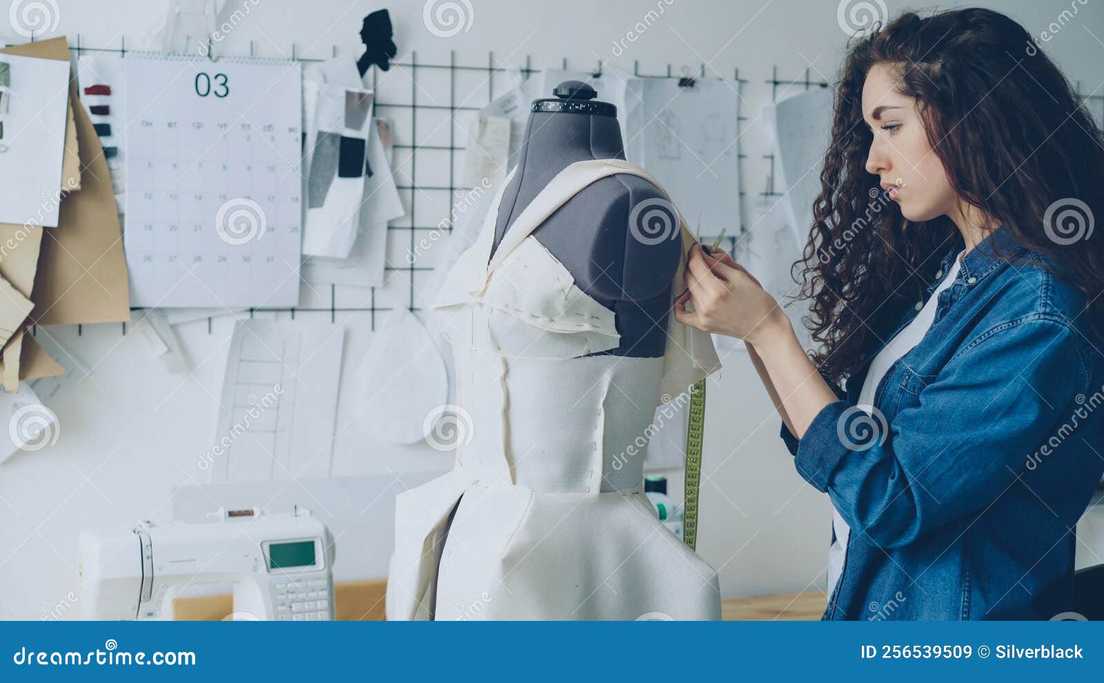 Young Female Tailor is Adjusting Clothes on Tailoring Dummy with Sewing ...