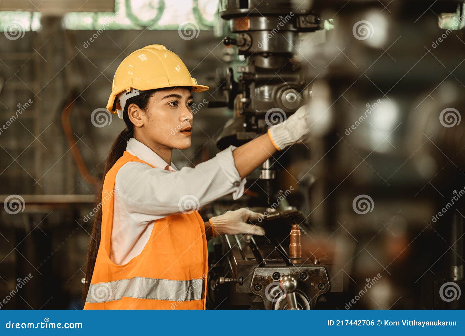 young female women attend worker happy working in metal factory workplace work engineer fix maintenance heavy industry machine