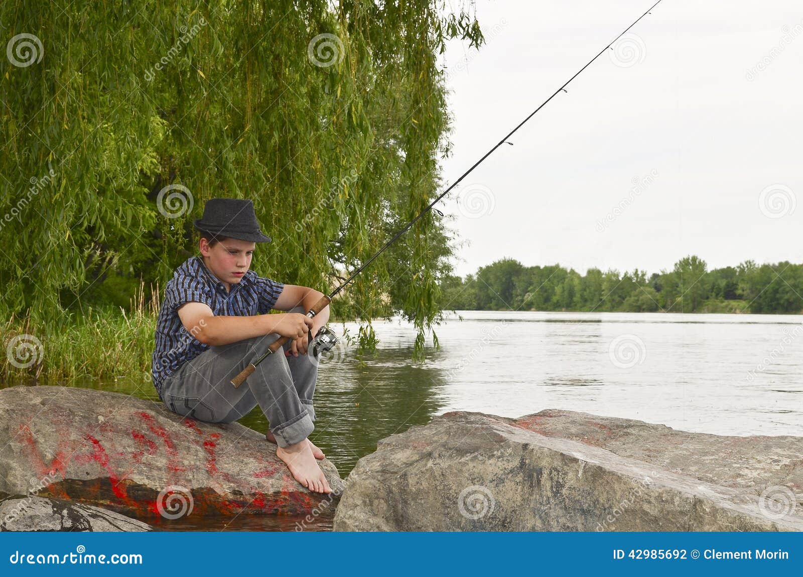 Boy Fishing Sitting Rock Stock Photos - Free & Royalty-Free Stock