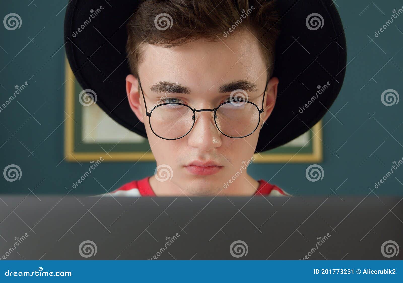 young freelancer man working on computer at home. busy stylish hipster er developing new project