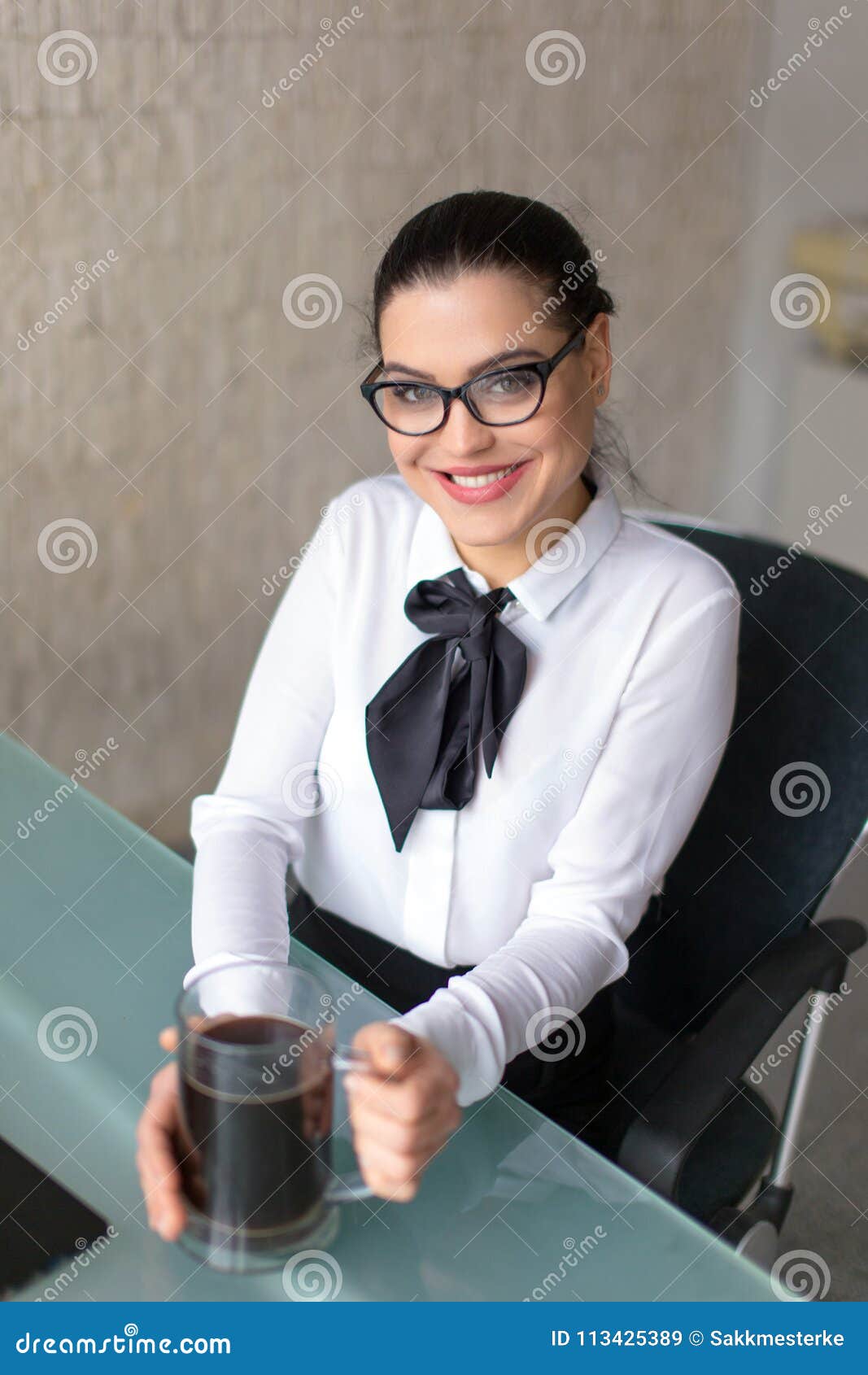 Young Fresh Smart Businesswoman In Glasses Holding Big Mug Of Co Stock 