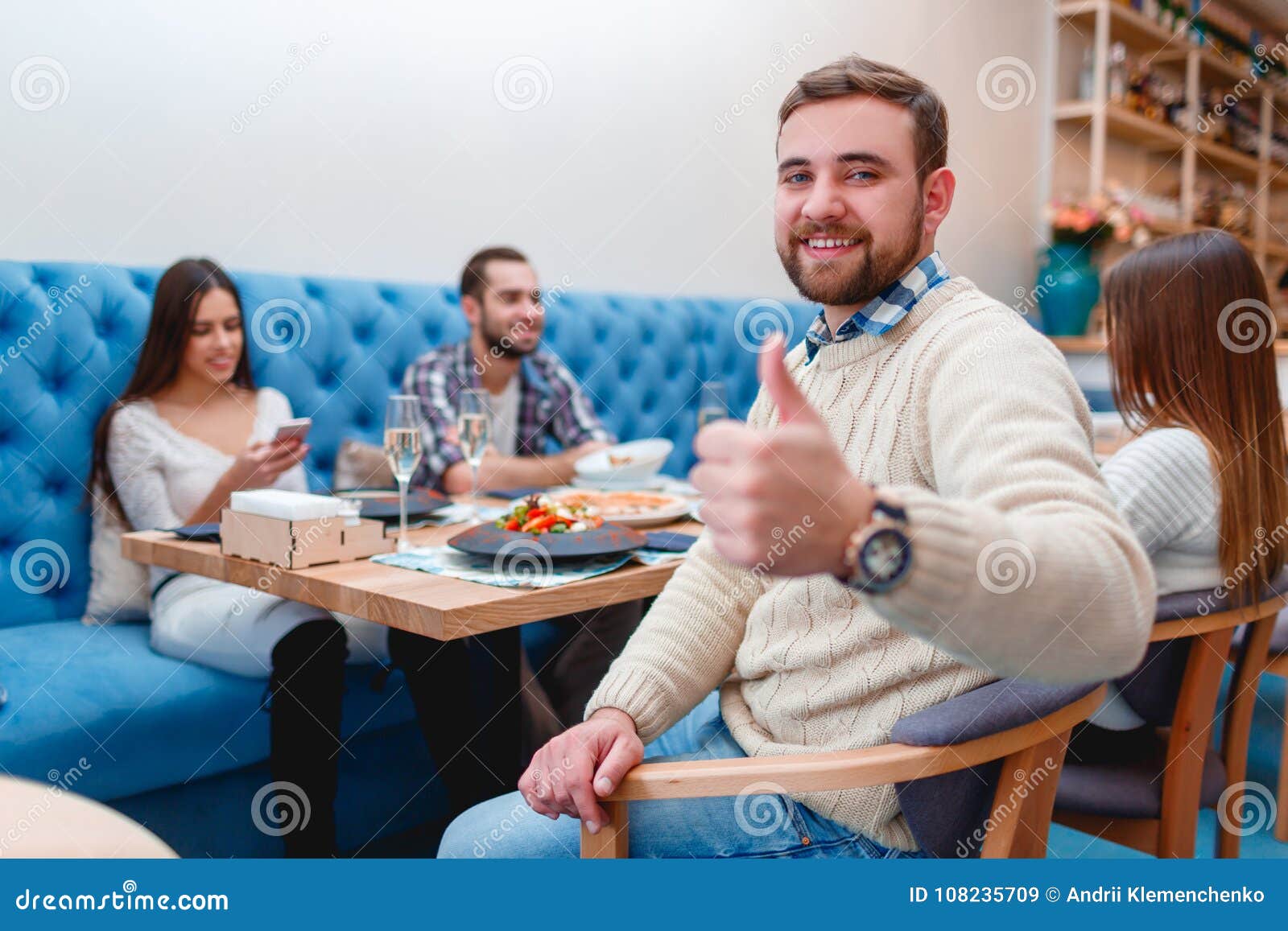 Happy Friends Having Dinner in Good Restaurant. Stock Image - Image of