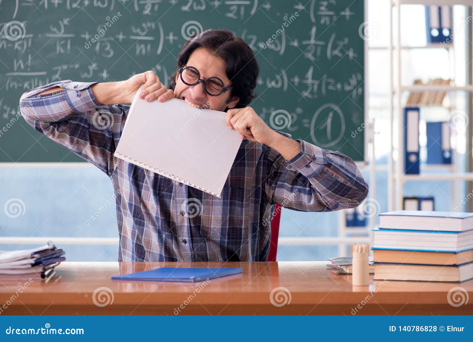 The Young Funny Math Teacher in Front of Chalkboard Stock Photo ...