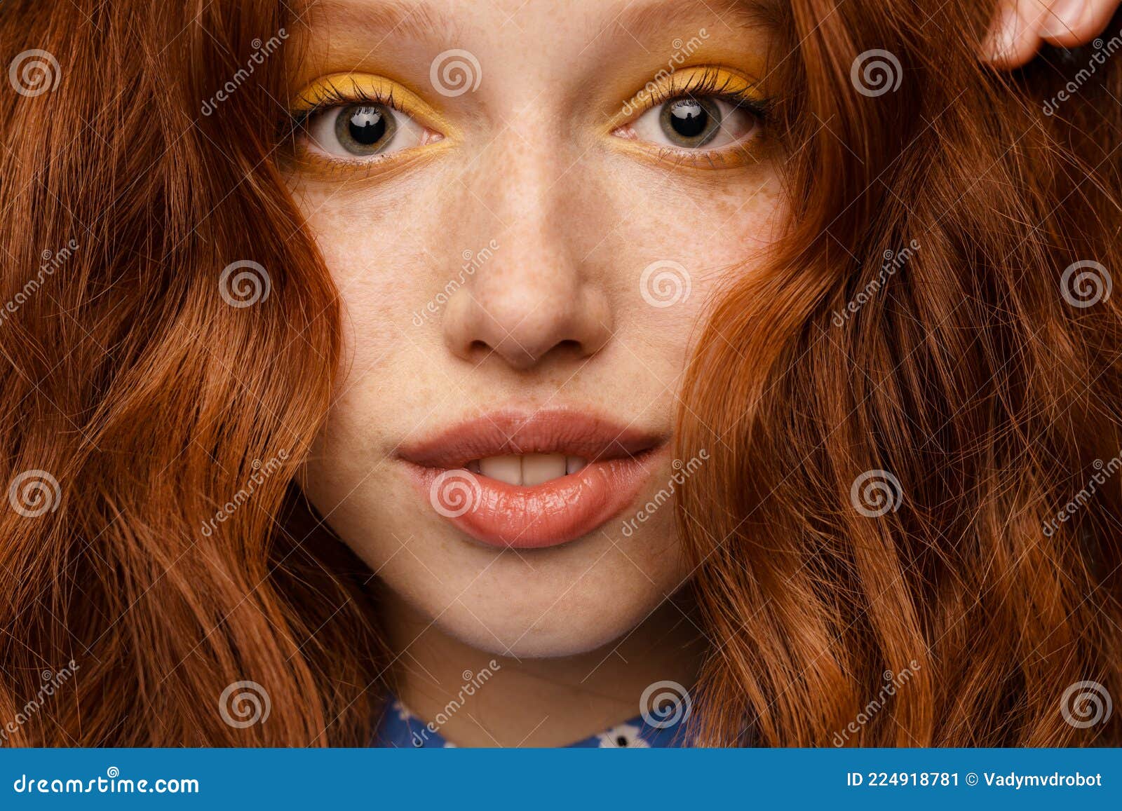 Young Ginger White Woman with Makeup Posing and Looking at Camera Stock