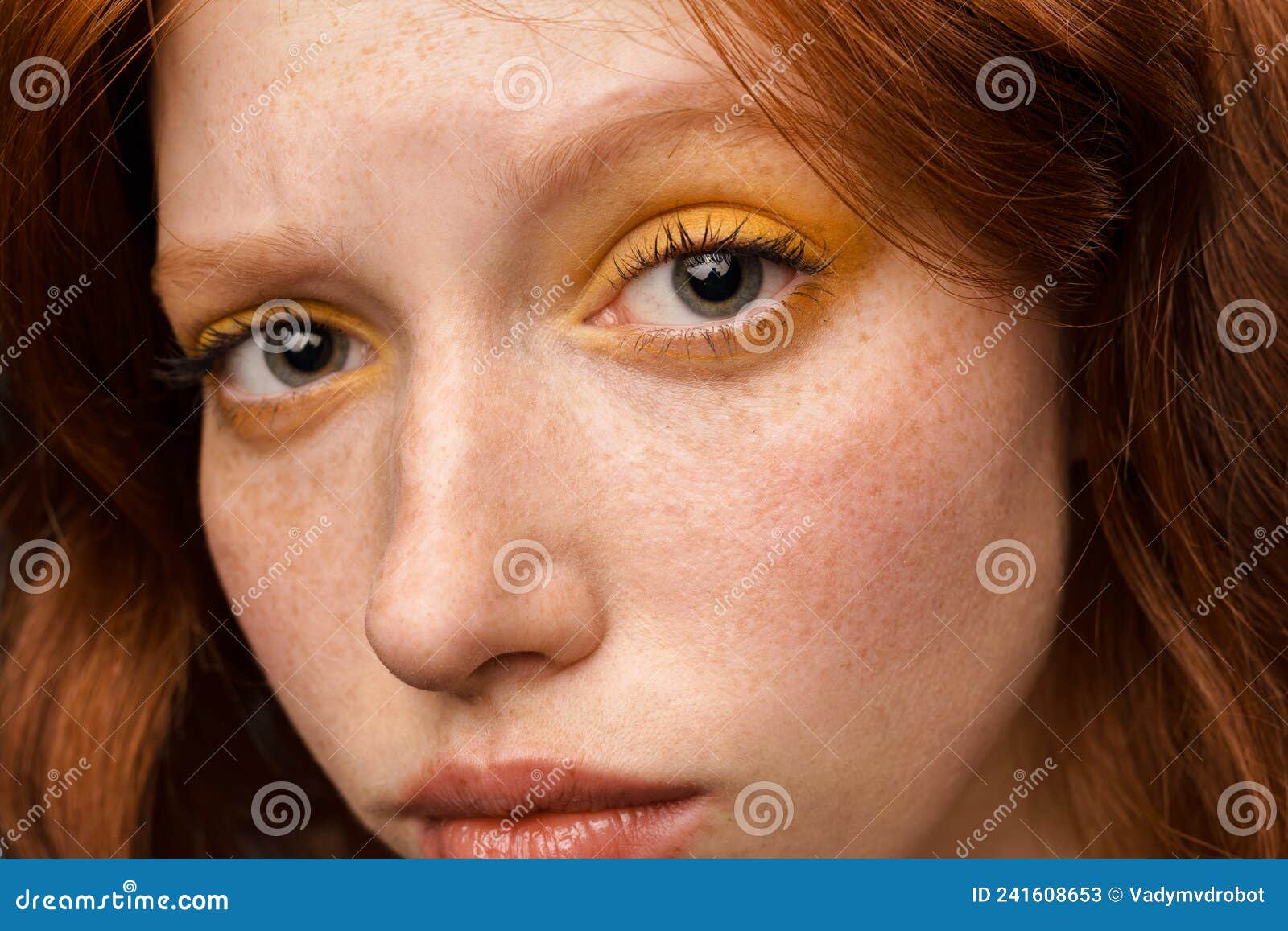 Young Ginger White Woman with Makeup Posing and Looking at Camera Stock