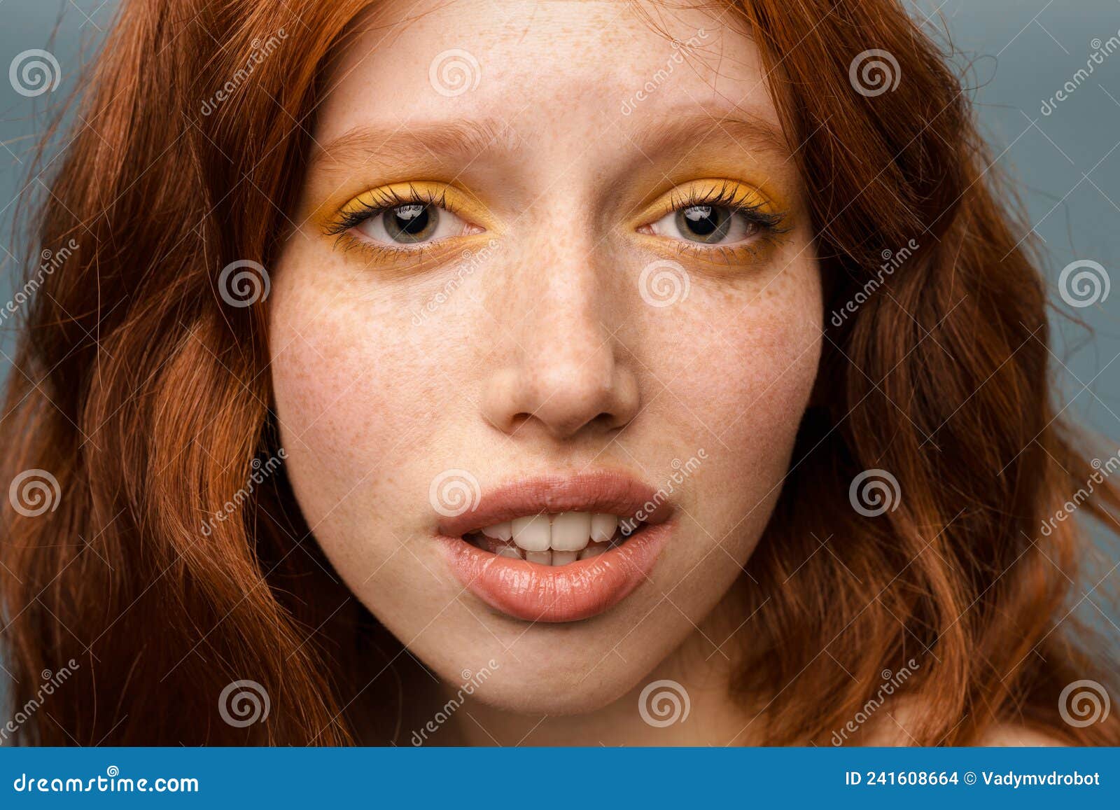 Young Ginger White Woman with Makeup Posing and Looking at Camera Stock