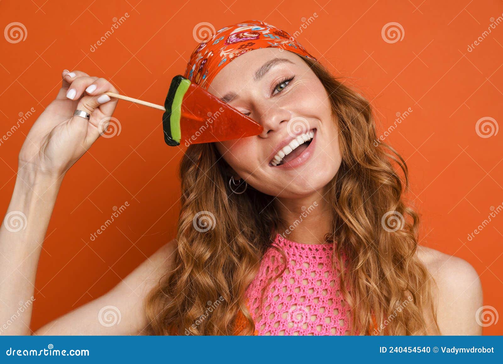 Young Ginger Woman Wearing Bandana Smiling while Posing with Lollipop Stock  Photo - Image of ginger, orange: 240454540