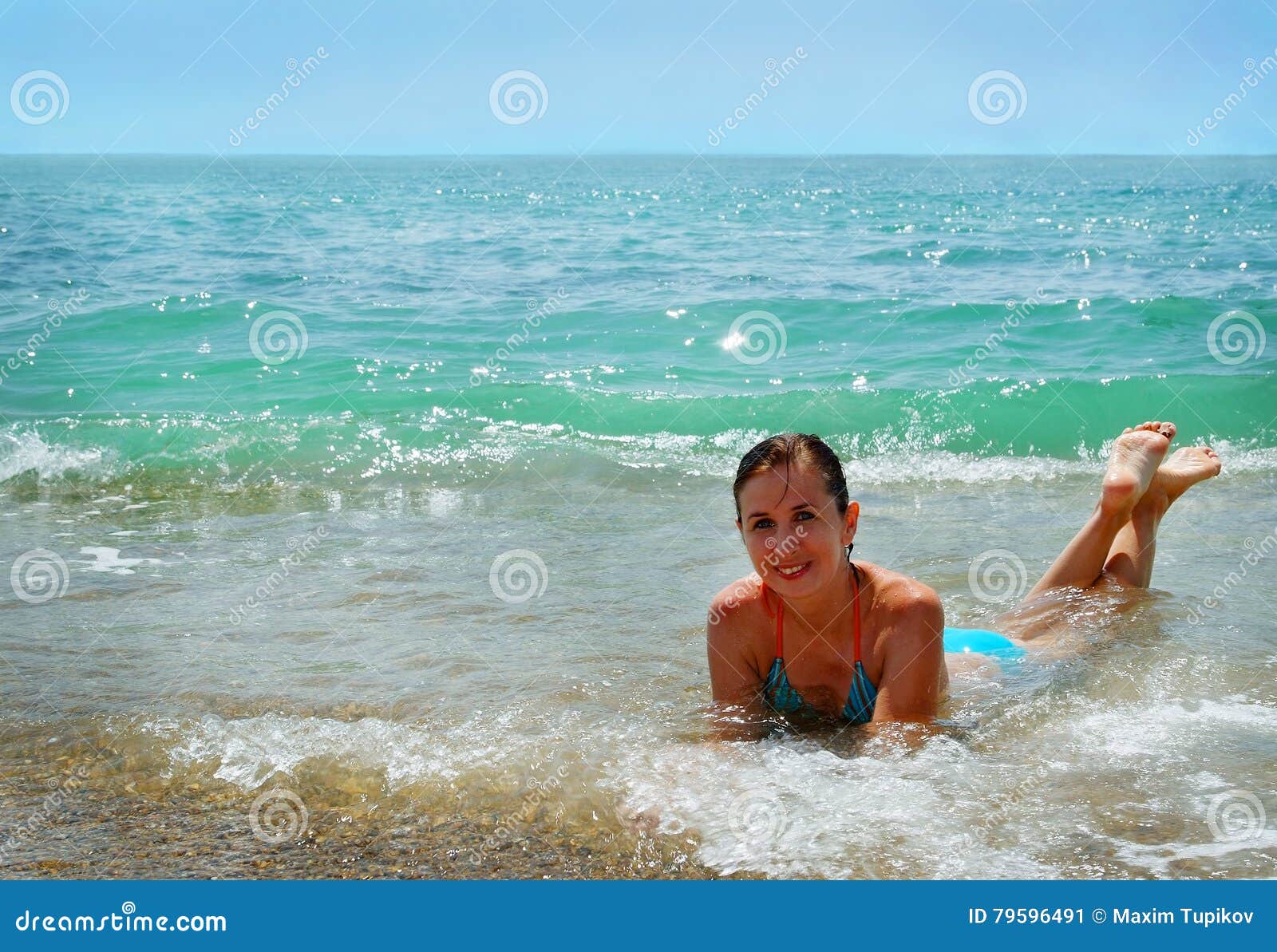 Little girls playing in the sea at seaside Southsea 