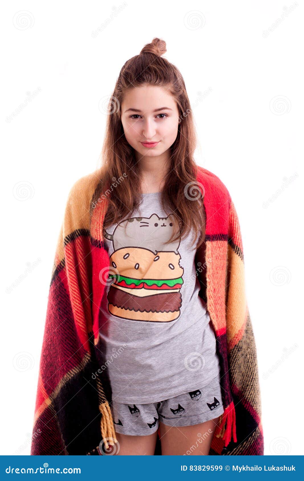 Young Girl in Bedclothes Covered with Blanket Posing Stock Image