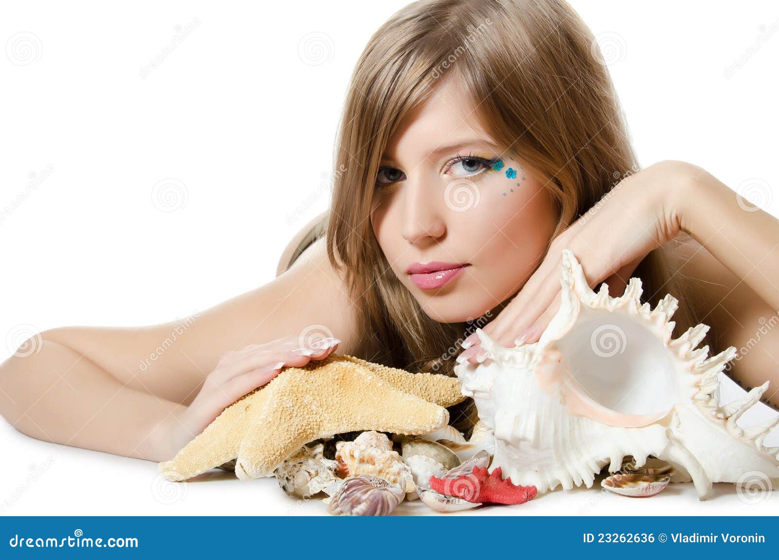The Young Girl in Bikini Lays with Seashells Stock Photo Image of