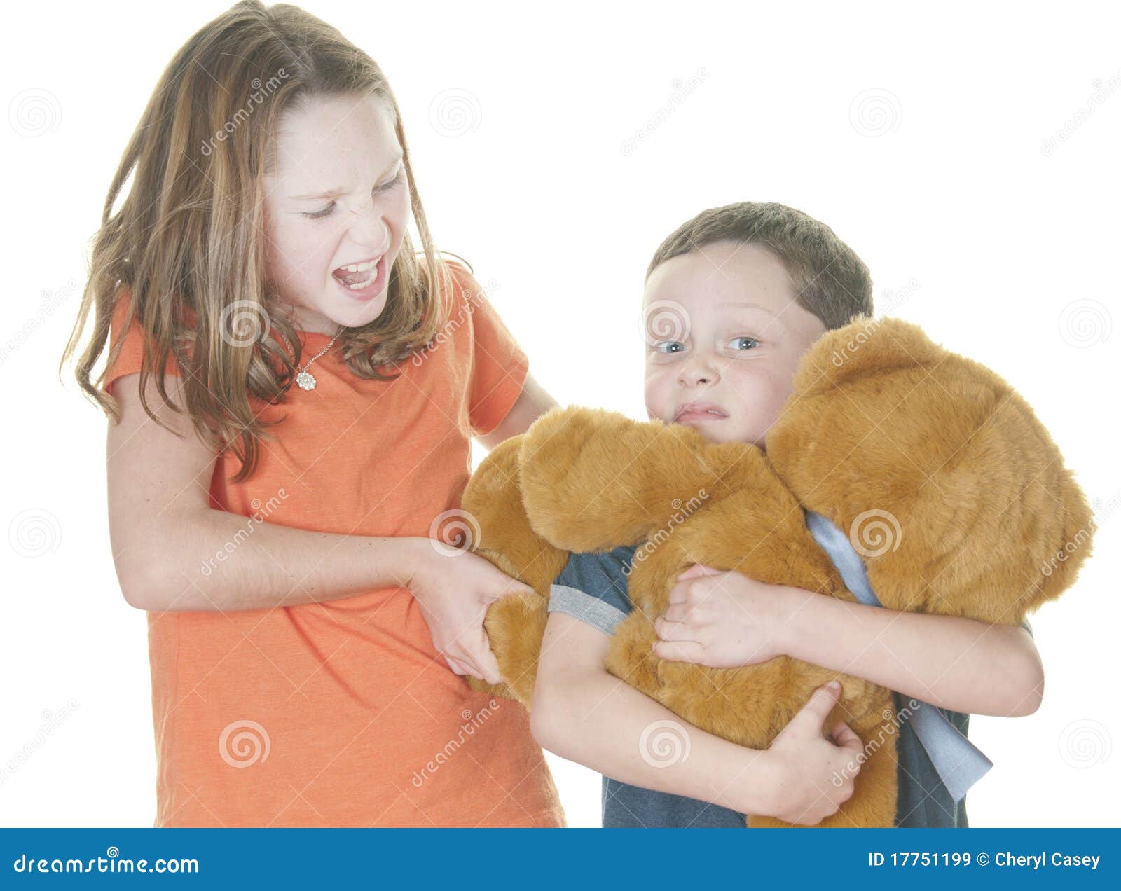 young girl and boy fighting over bear