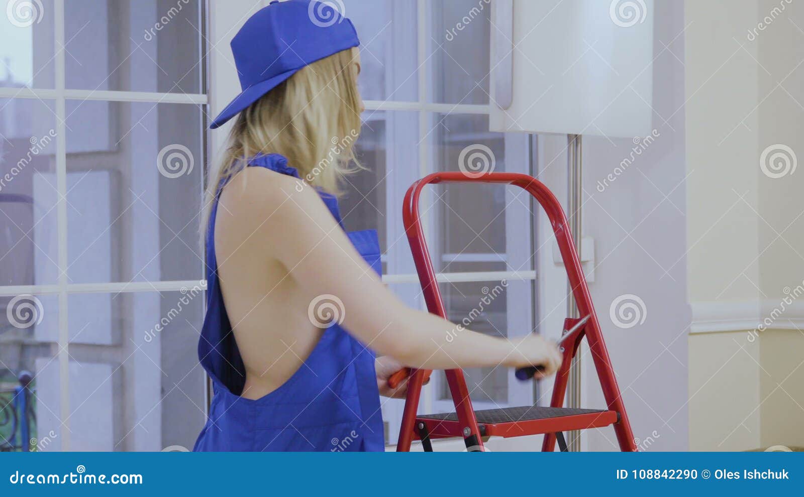 Beautiful Naked Girl In Blue Overalls Posing For Camera Stock Footage