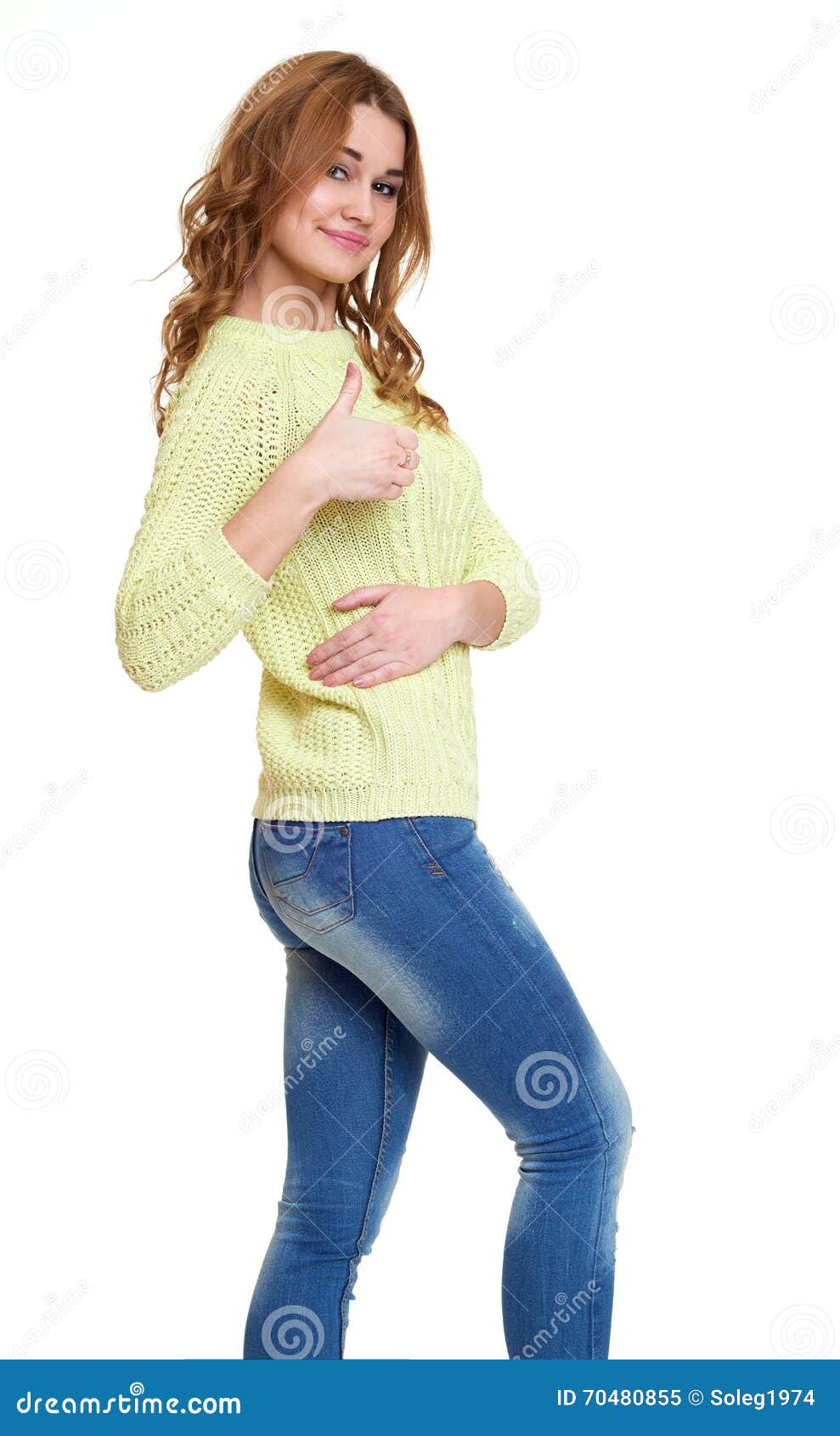 Young Girl Casual Dressed Jeans and a Green Sweater Posing in Studio ...