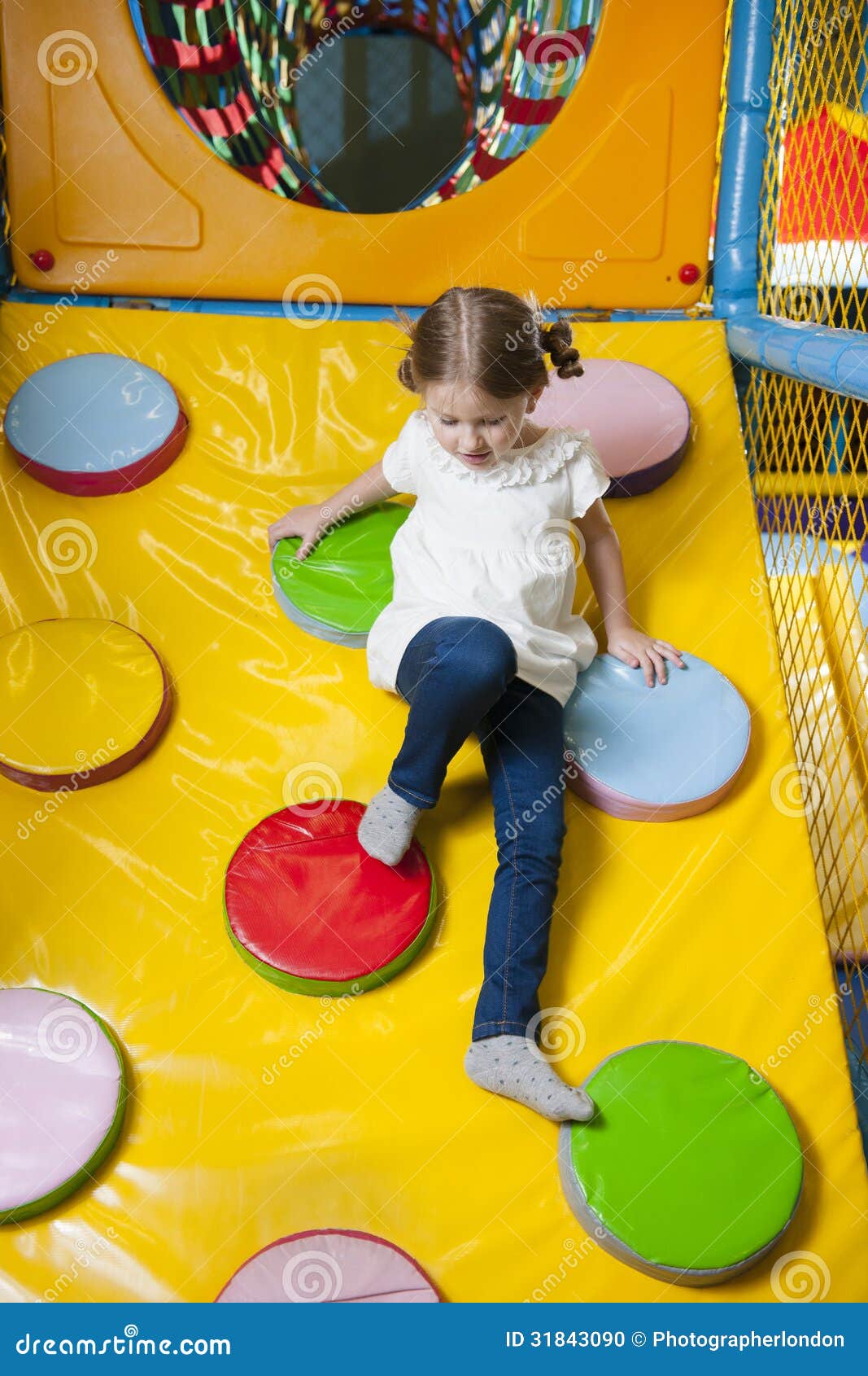 Young Girl Climbing Down Ramp in Soft Play Centre Stock Photo Image
