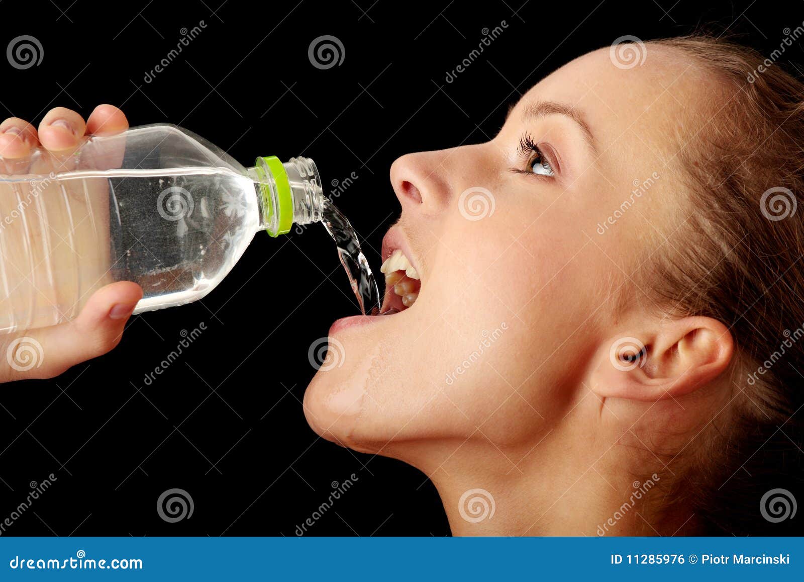 portrait of young sportive teen girl with a bottle of drinking water Stock  Photo