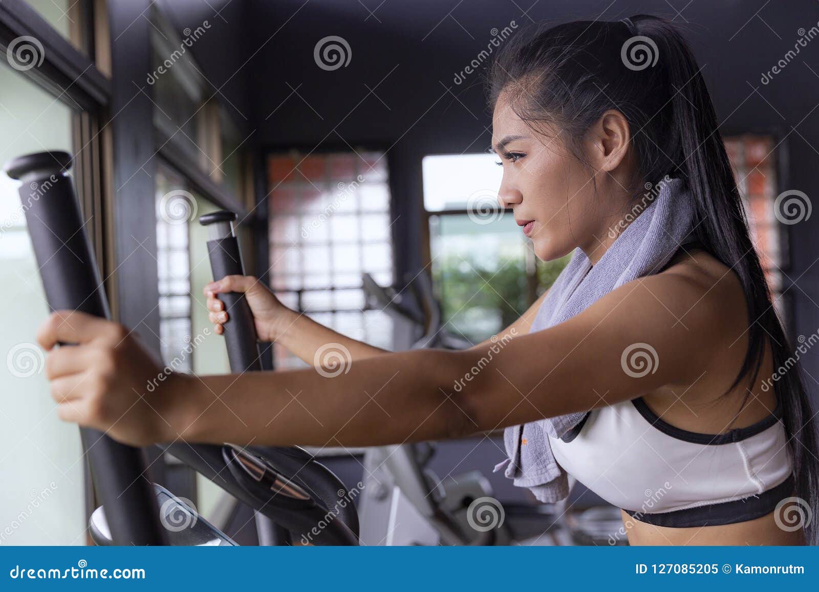 young girl exercise bike cardio workout at fitness gym