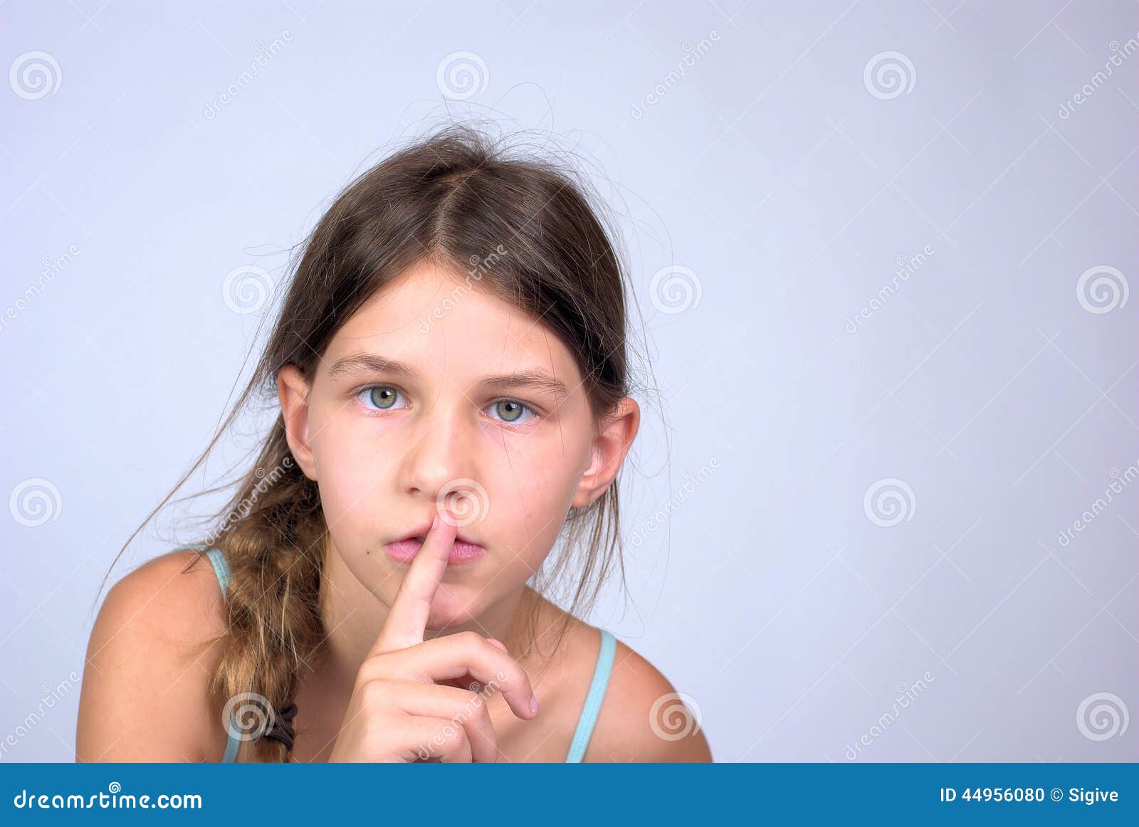 Young Girl With Finger On Lips Shushing Stock Photo Image
