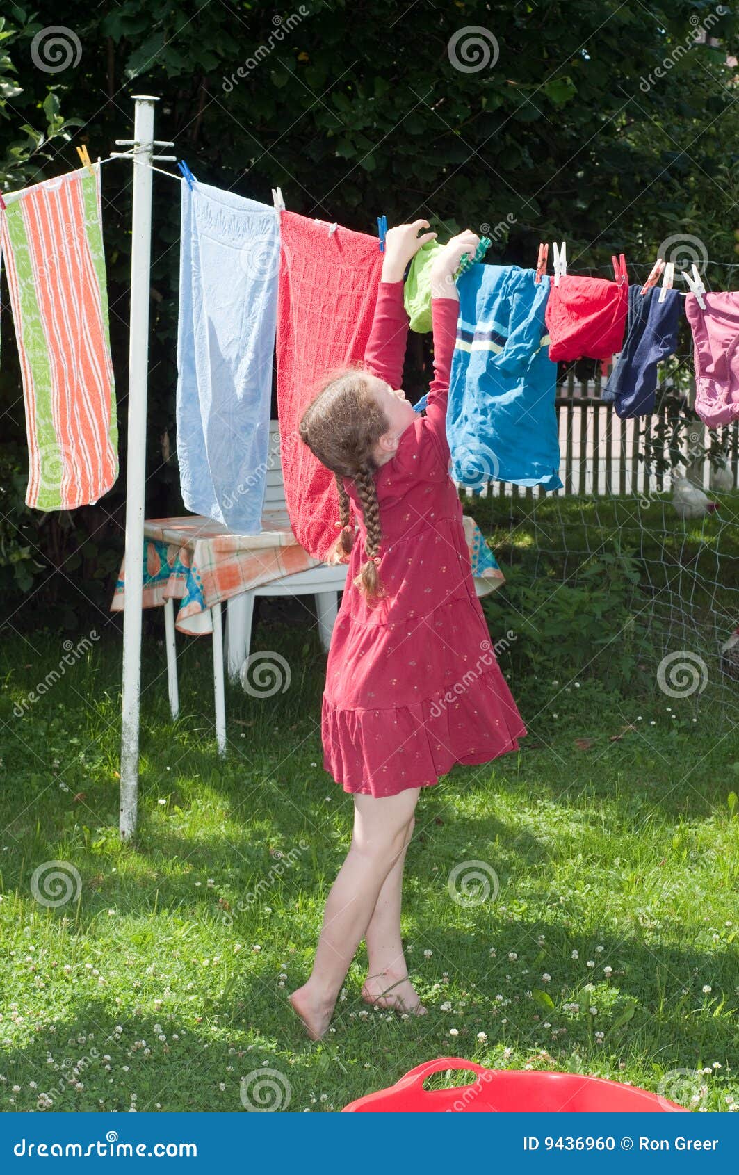 Young Girl Hanging Cloth To Dry Stock Photo Image of 