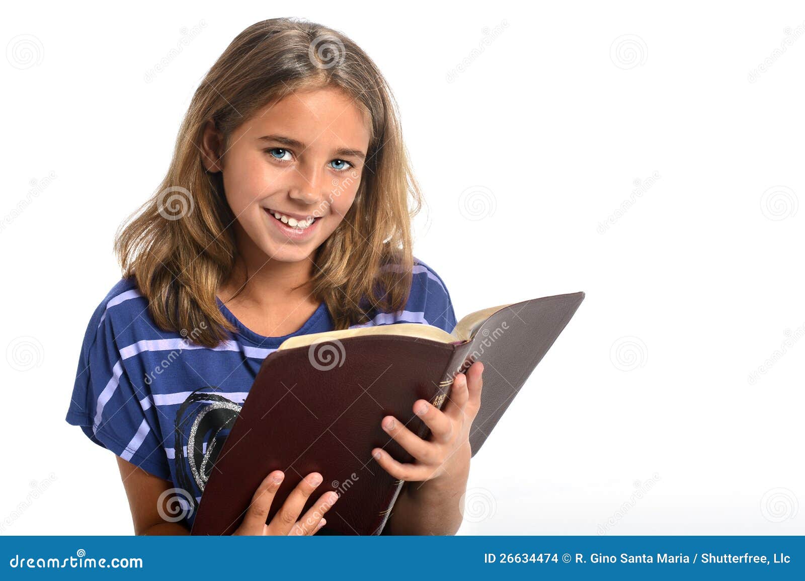 Young Girl Holding Bible stock photo. Image of reading 26634474