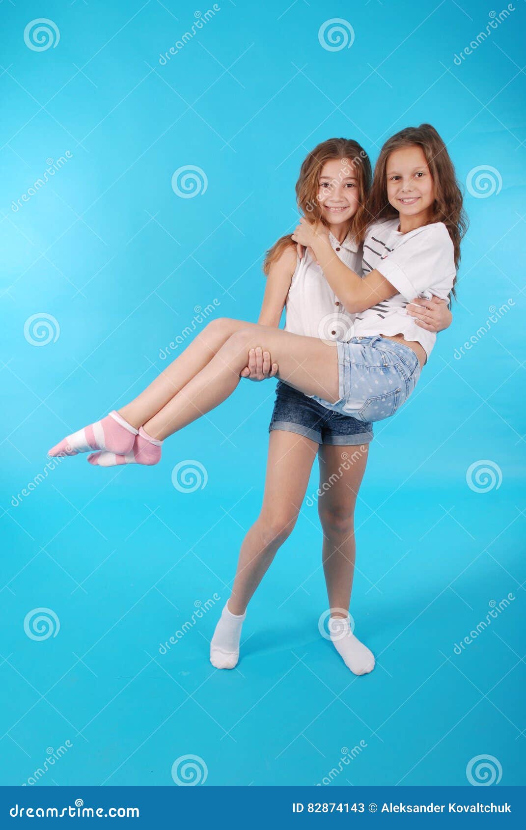 Young Girl Holds In His Arms Her Girlfriend Stock Image Image Of Fashion Attractive 82874143 