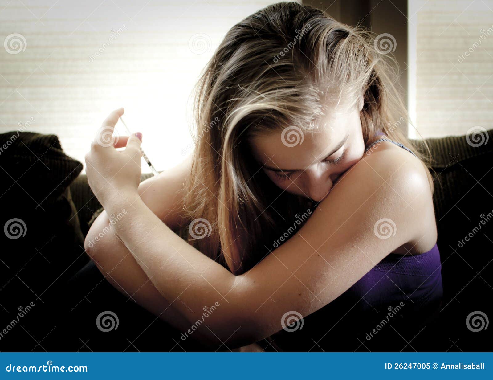 young girl injecting insulin