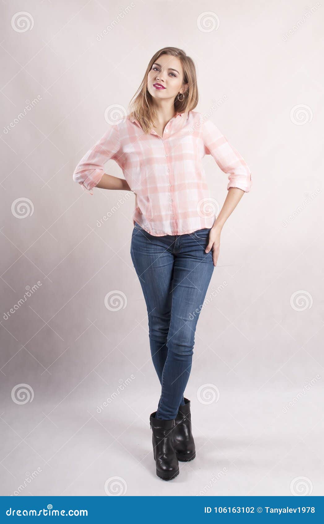 Young Girl in Jeans and a Shirt Stock Photo Image of background, hair