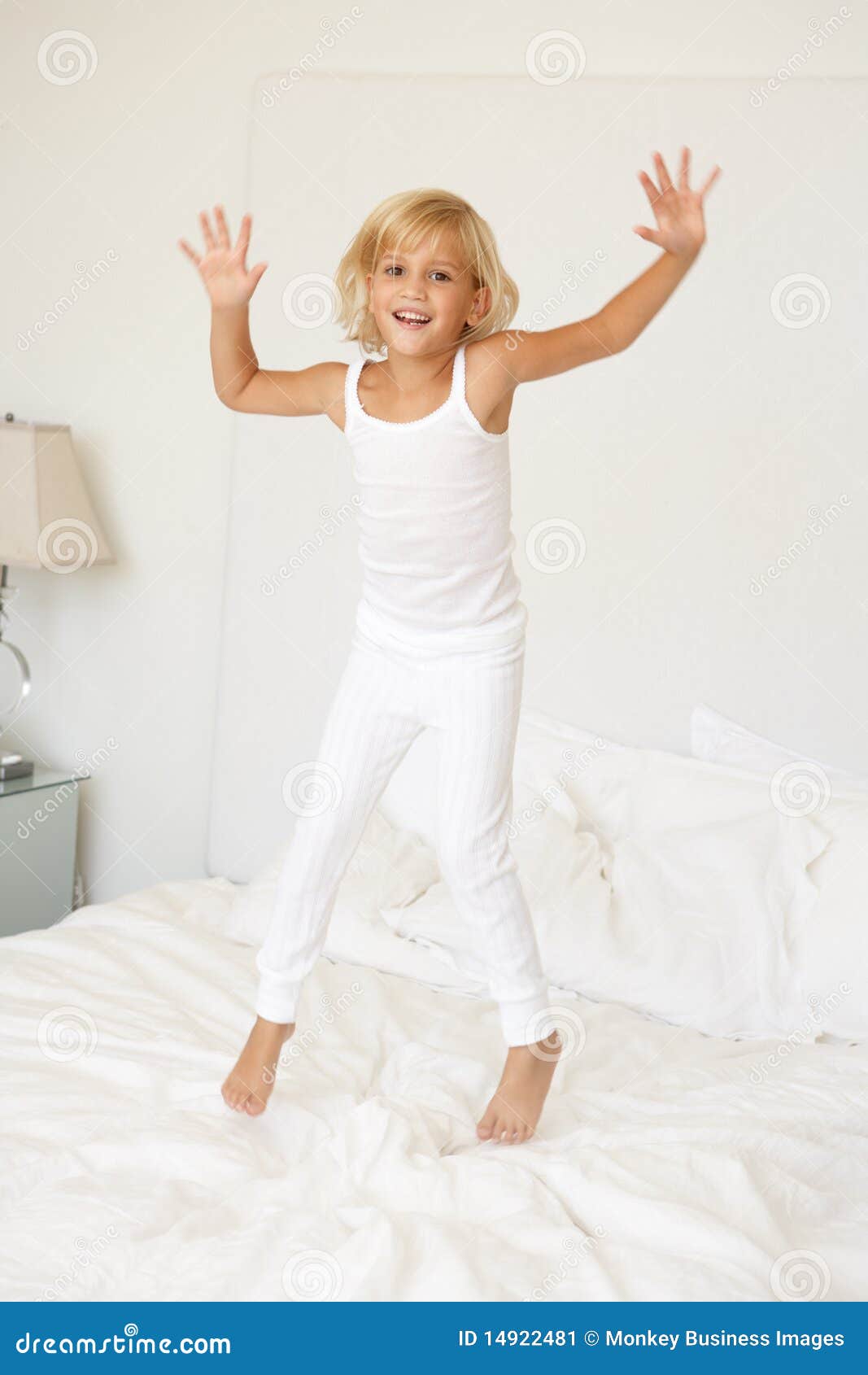 Young Girl Jumping on Bed stock image. Image of length 14922481