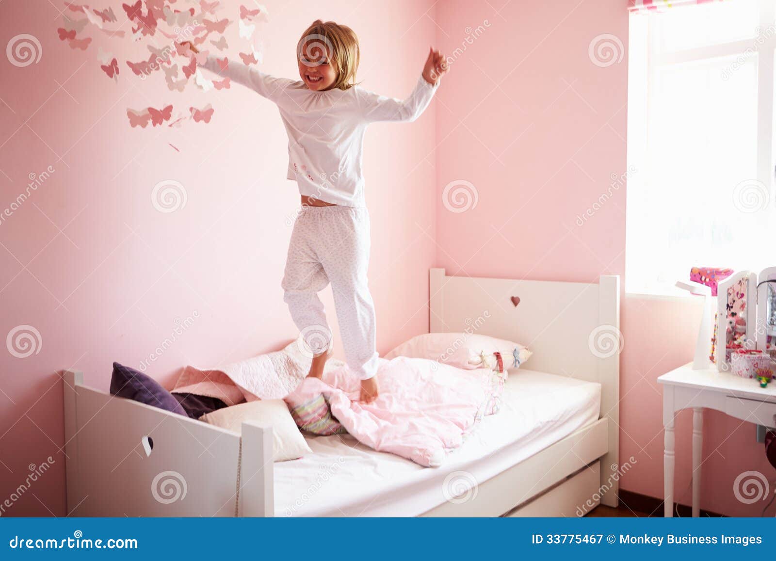 Young Girl Jumping on Her Bed Stock Image Image of bedding, leap 33775467