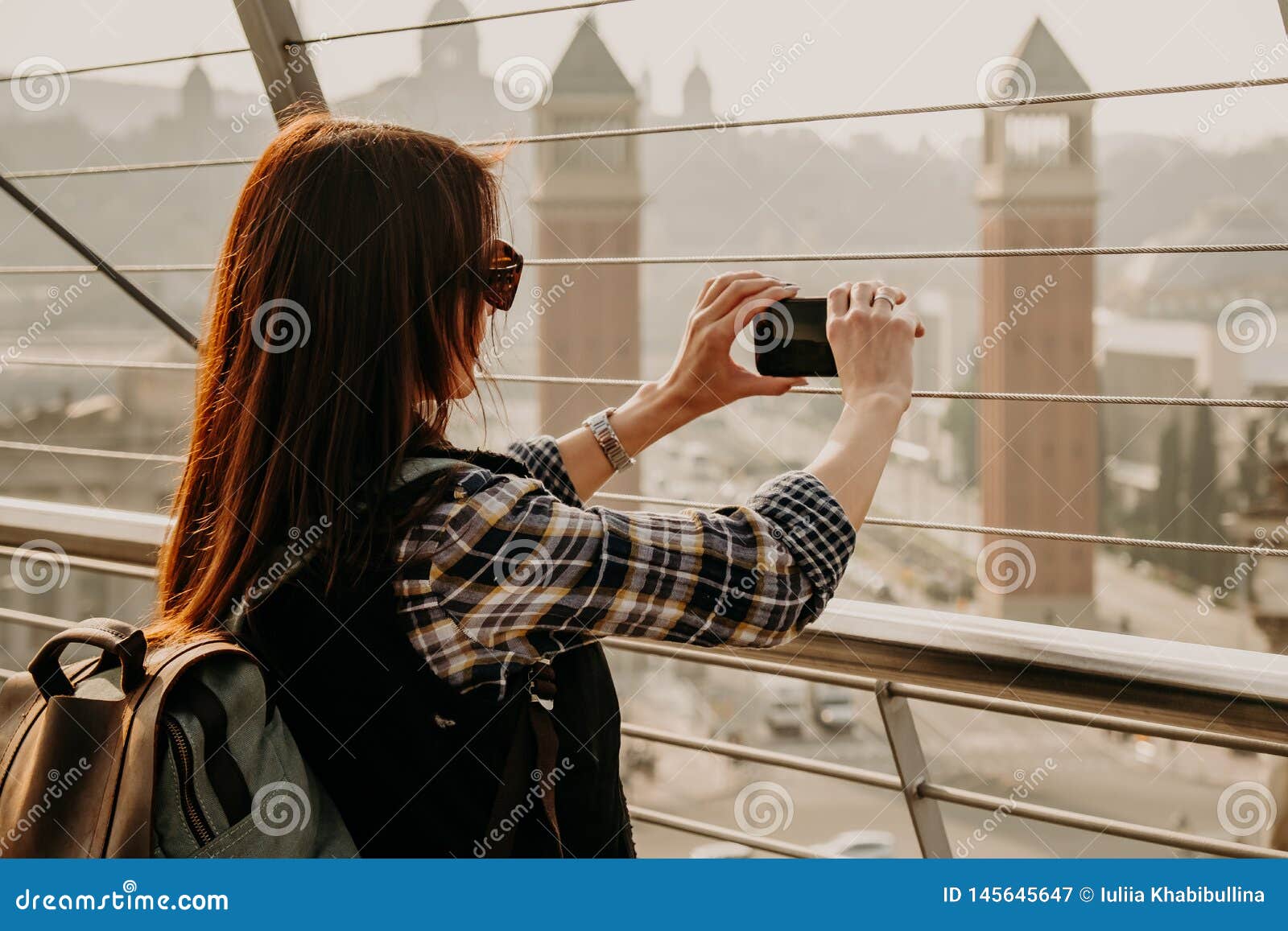 Young Girl With Long Brown Hair Standing On View Point And Taking A