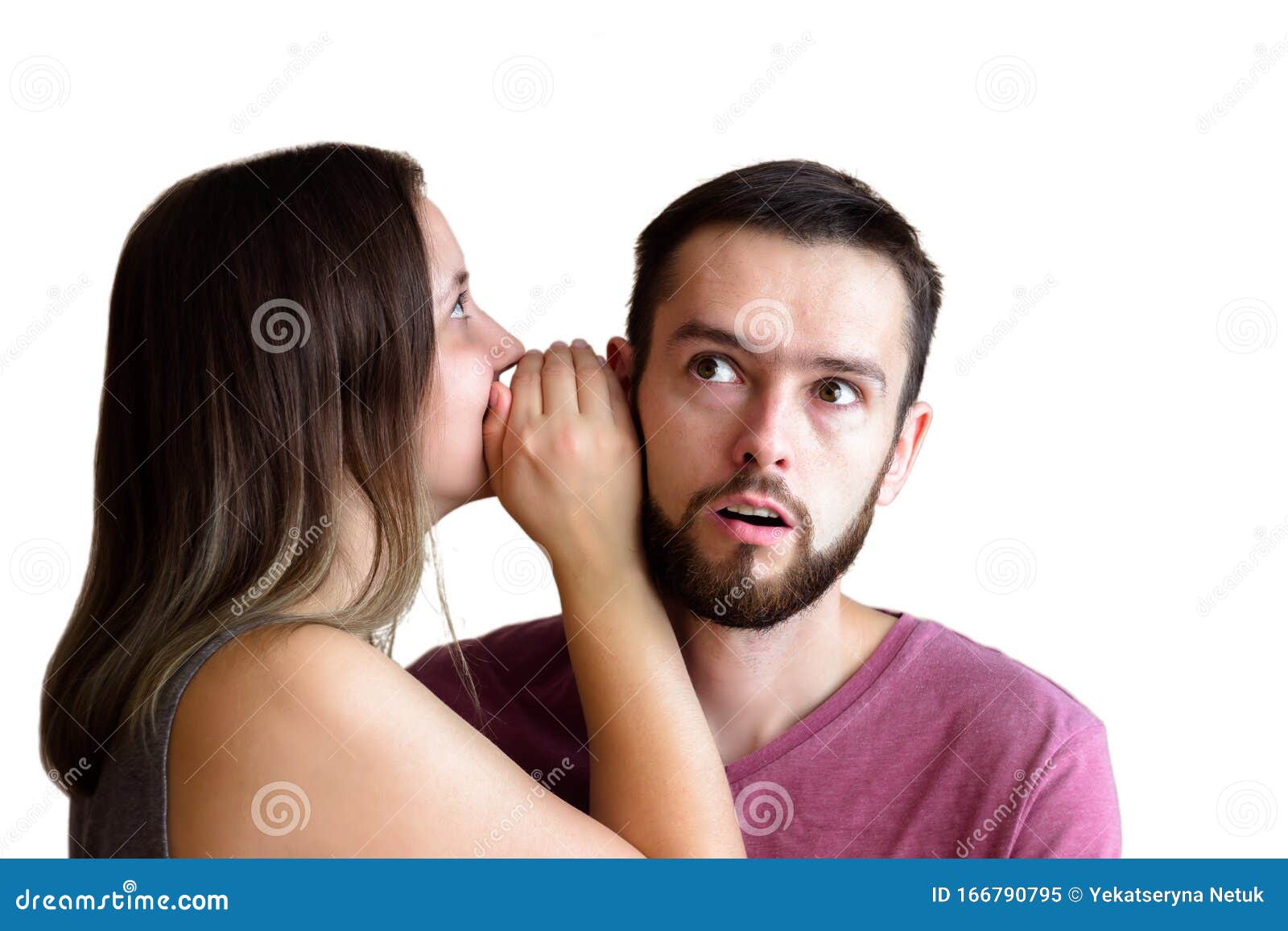 A Young Girl with Long Hair Guy Whispers Something in His Ear and he Opened His Mouth in Surprise Stock Image