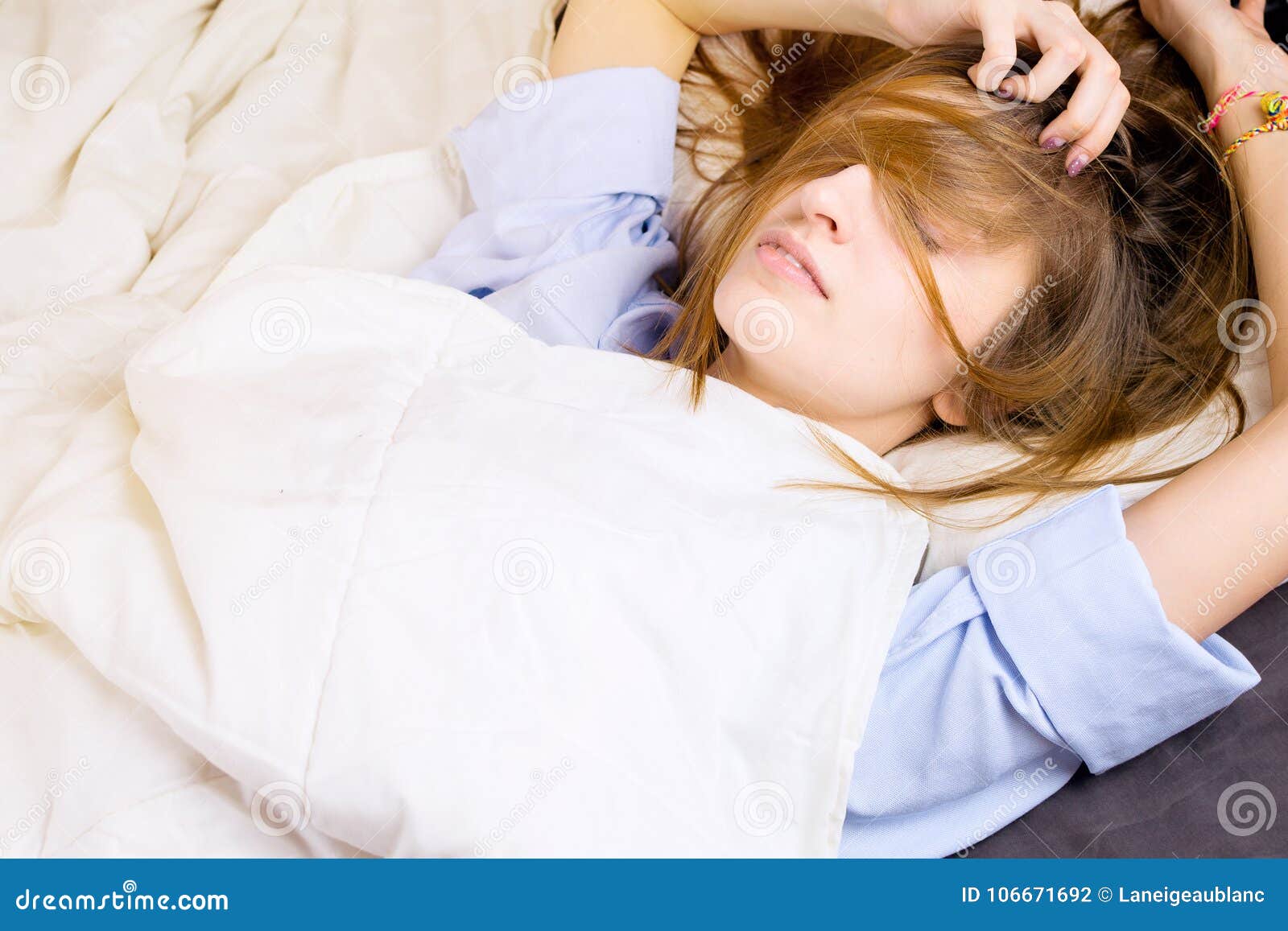 Young Girl Lying in Her Bed with Messy Hair Covering Her Face. Stock Photo  - Image of night, comfortable: 106671692