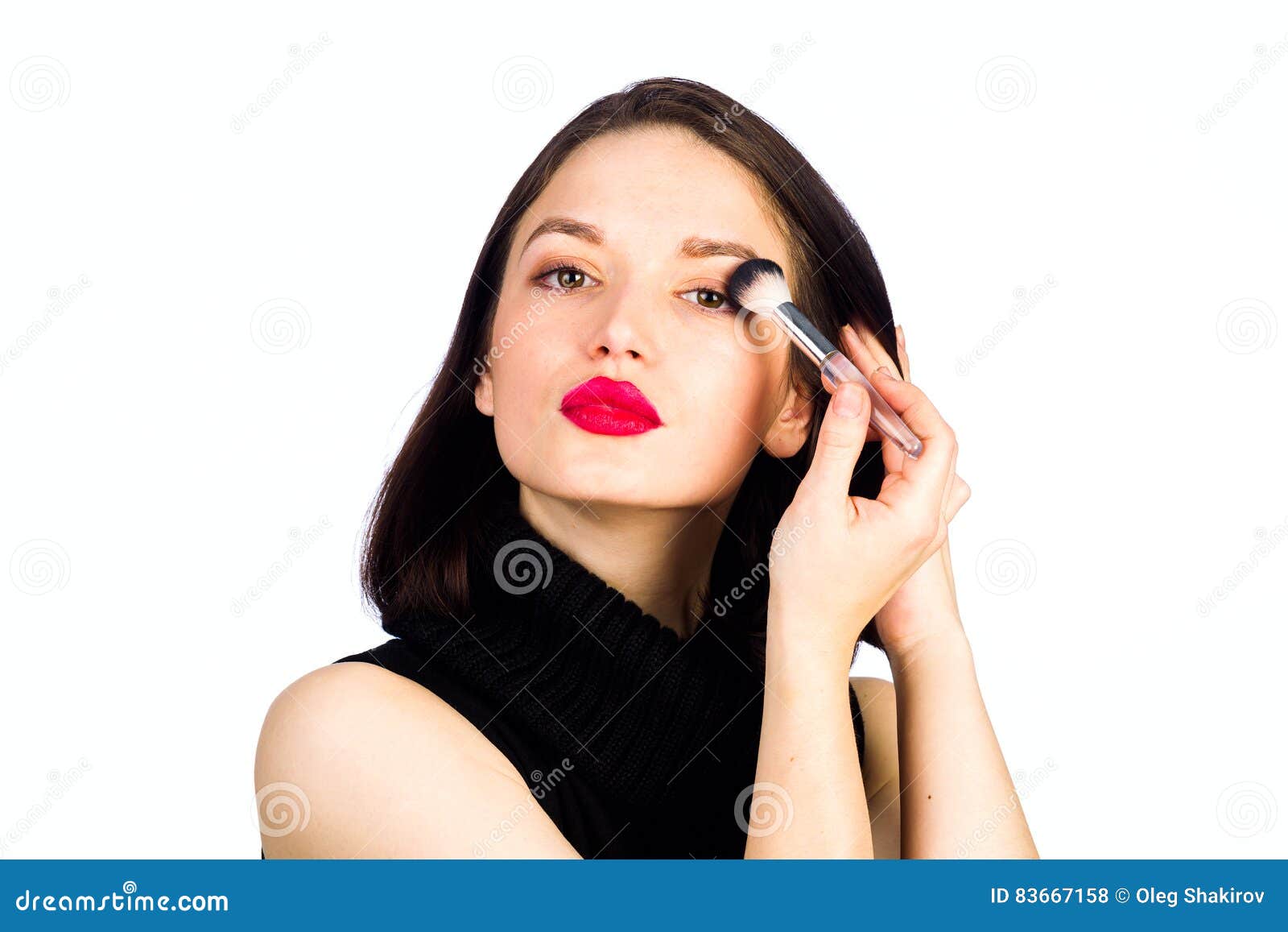 Young girl makes a makeup stock photo. Image of body 83667158