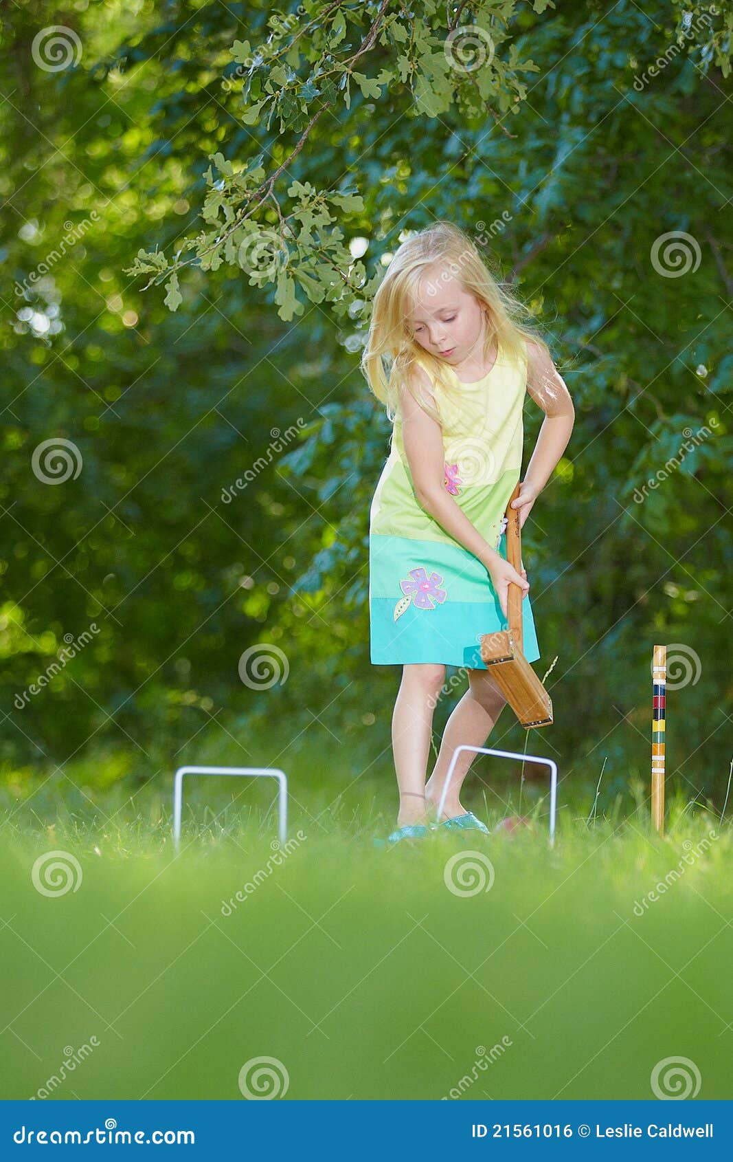 Young girl playing croquet stock photo. Image of lovable 21561016