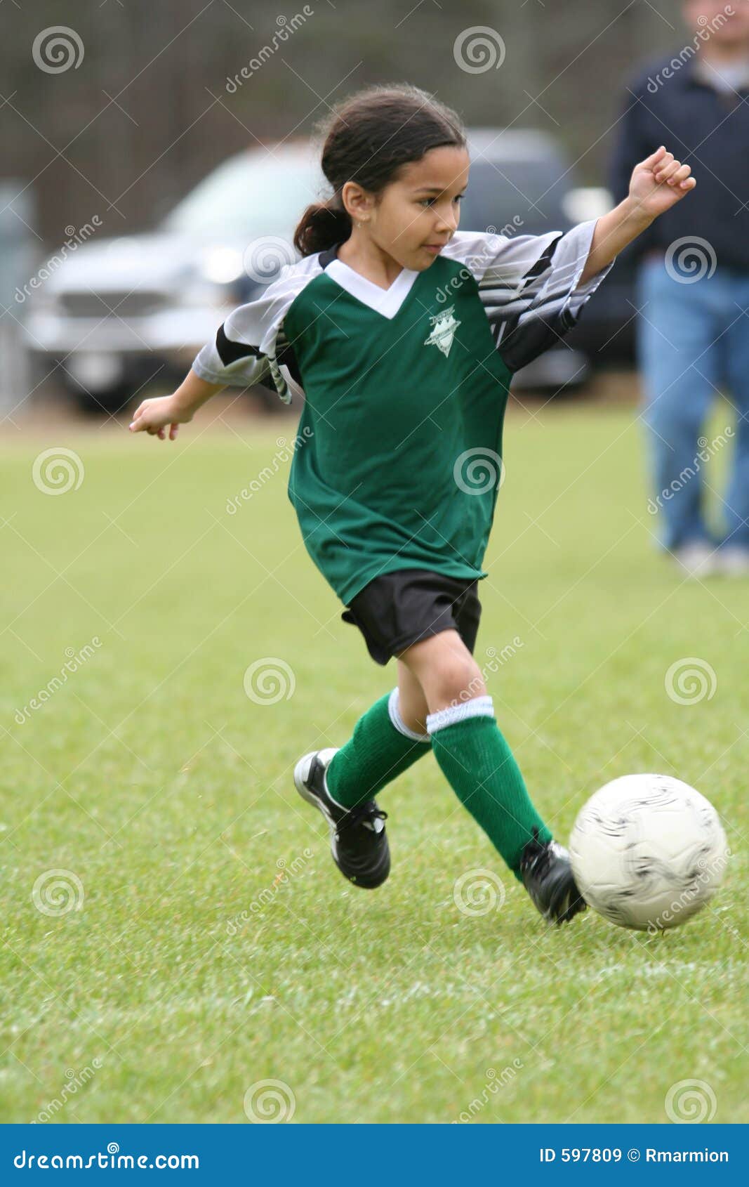 Young Girl Playing Soccer stock image. Image of children - 597809