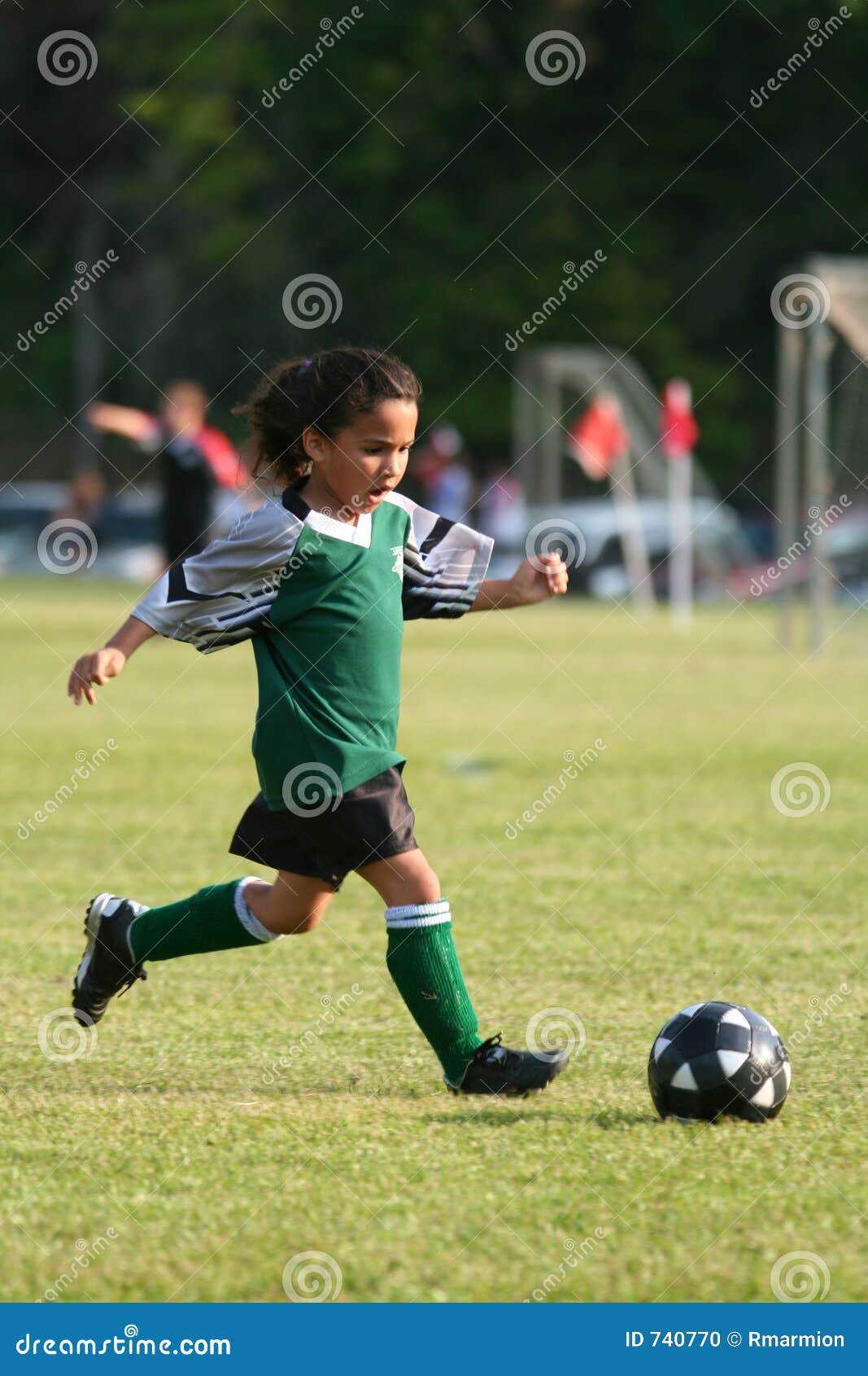 young girl playing soccer