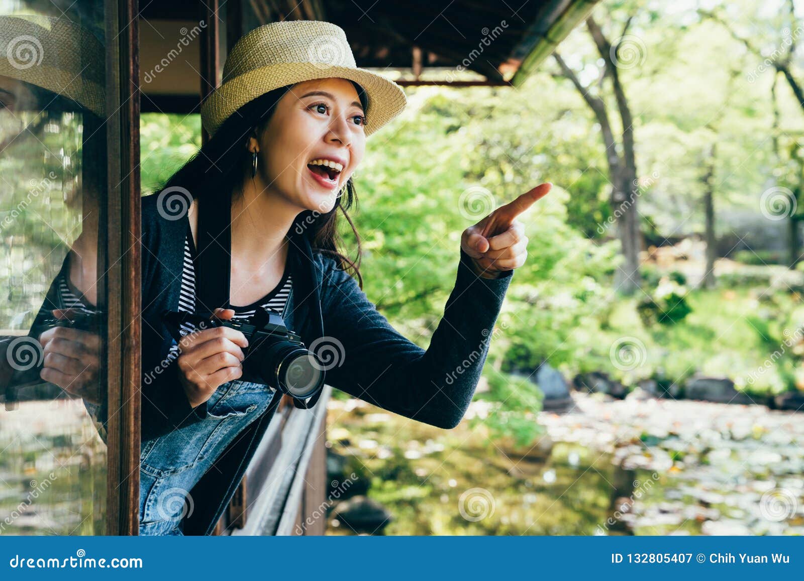 young girl pointing finger to nihon teien