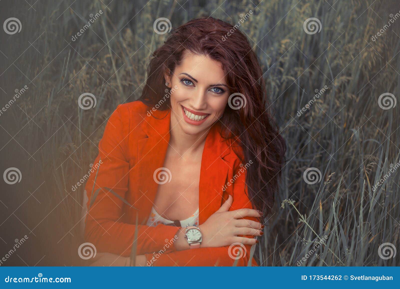 Cheerful girl on wheat field | Stock Photo | Colourbox