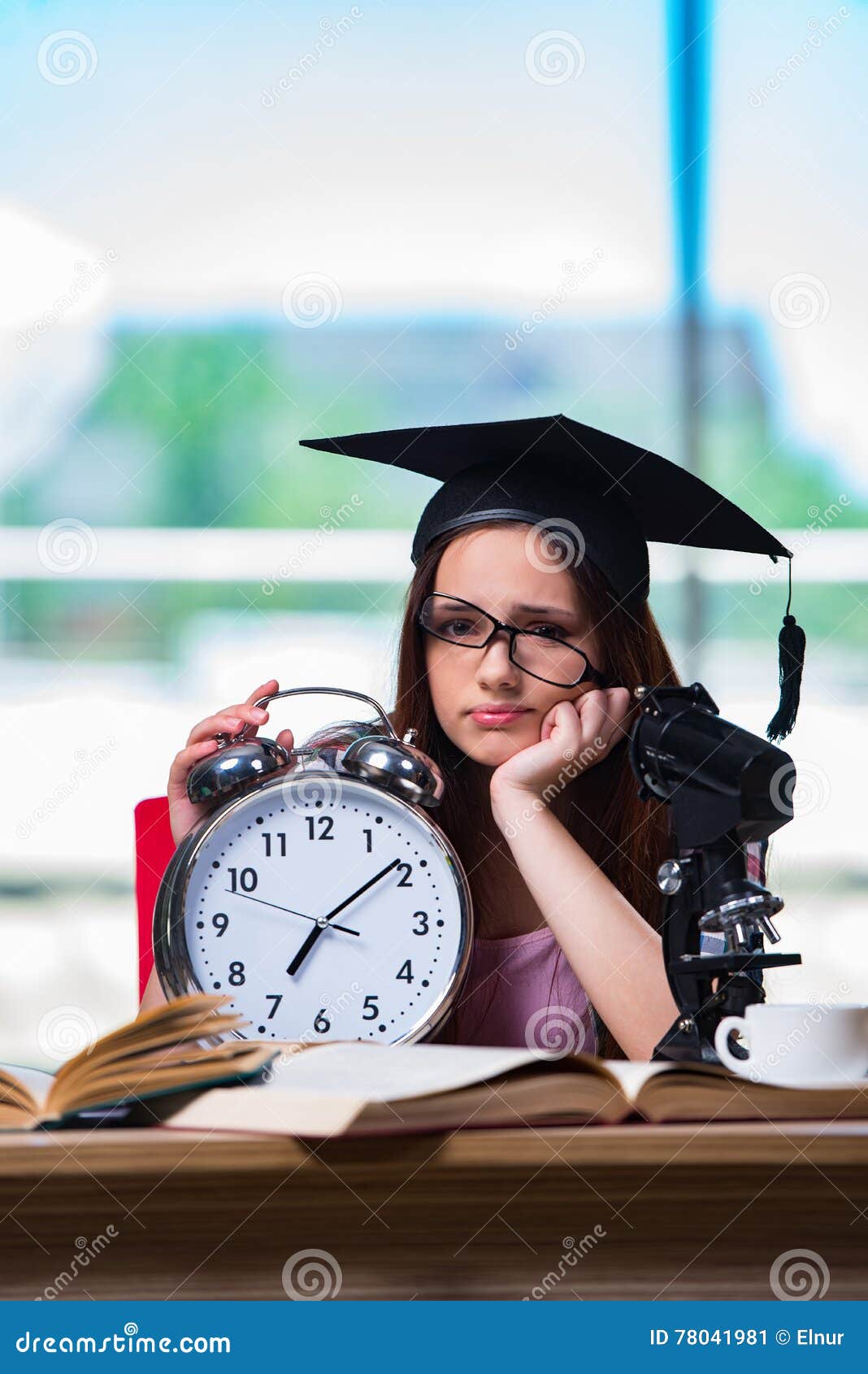 The Young Girl Preparing for Exams with Large Clock Stock Image Image