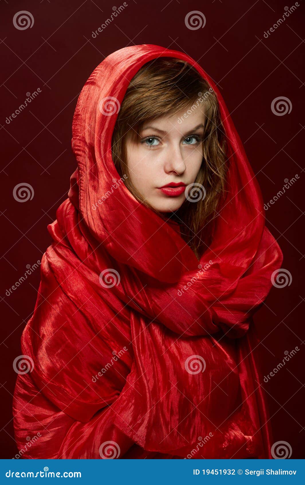 Young girl in a red hood stock photo. Image of intense 19451932