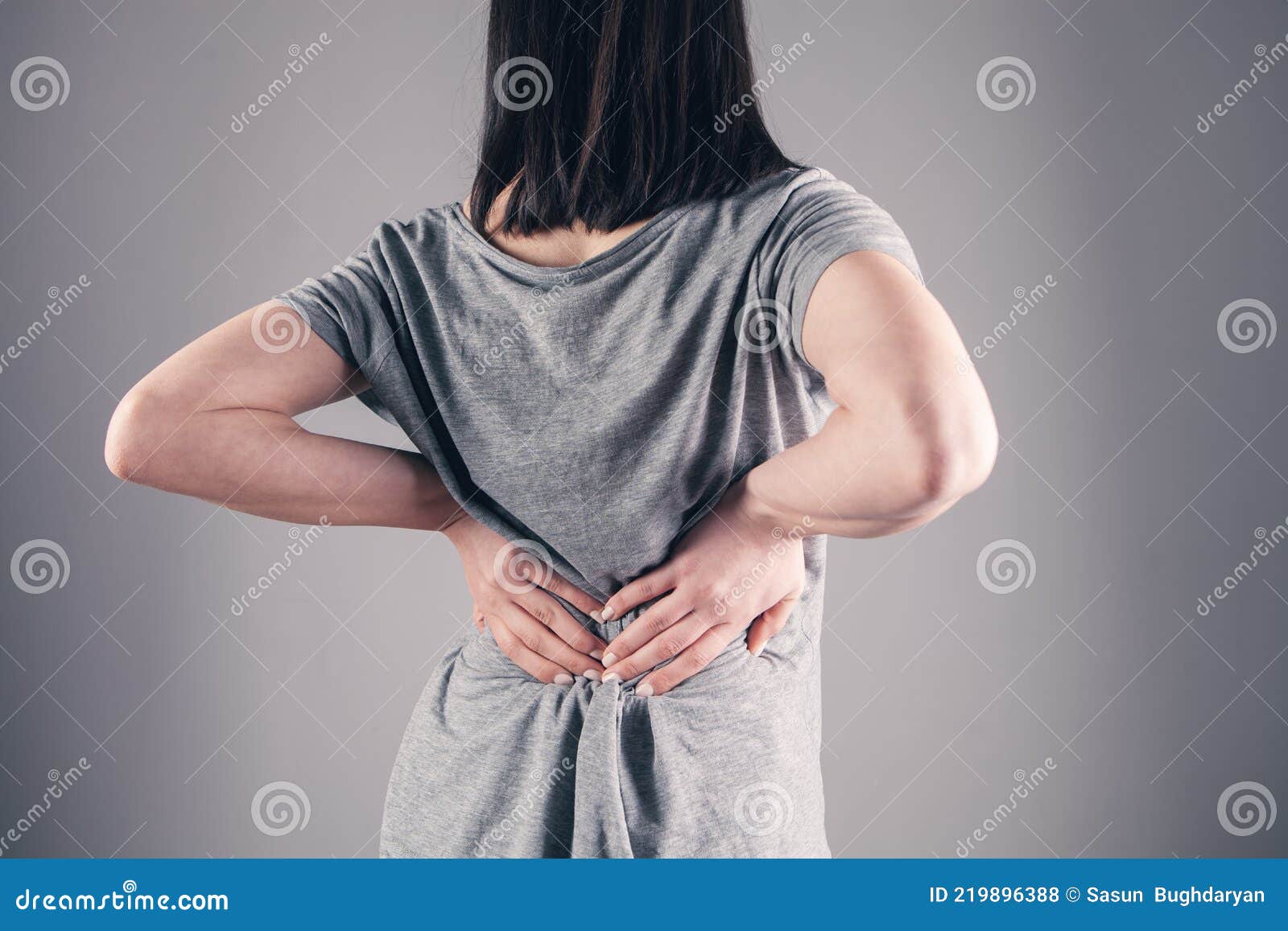 A young girl`s back hurts stock photo Image of medical 219896388