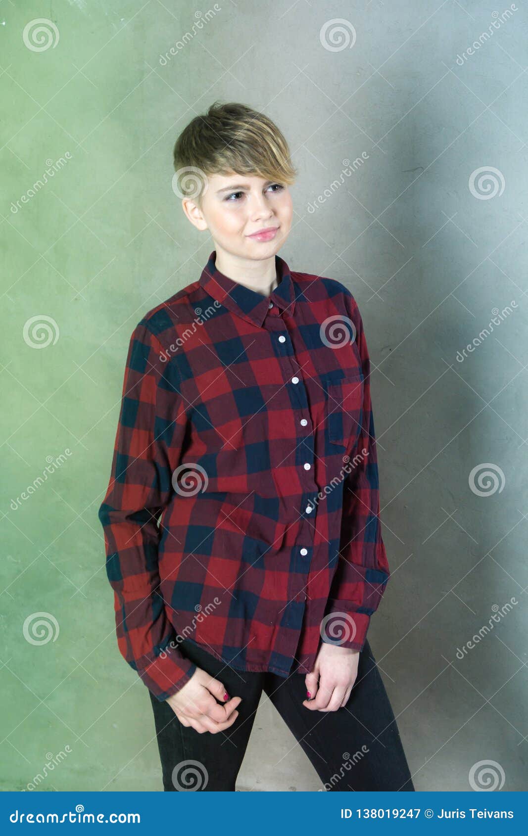 Young Girl With Short Haircut Concrete Wall On Background