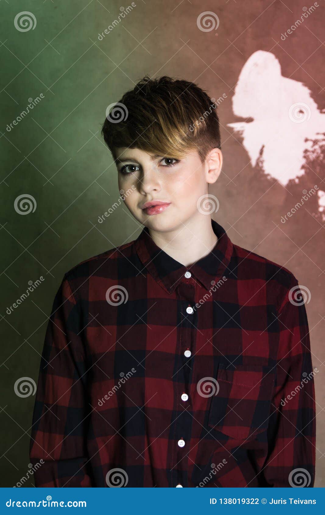 Young Girl With Short Haircut Concrete Wall On Background