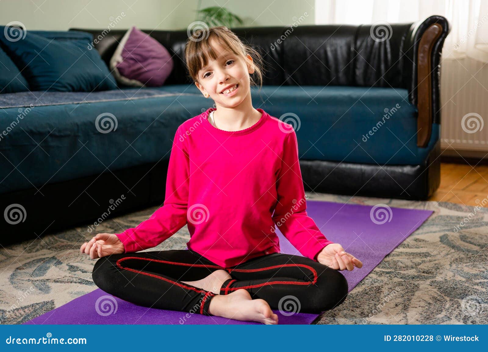 Young Yogi Woman Practicing Yoga At Home, Sitting Cross-legged In Sukhasana  Exercise, Easy Seat Pose, Working Out Wearing Sportswear Black Shorts, Top,  Indoor Full Length, Window Background, Rear View Stock Photo, Picture