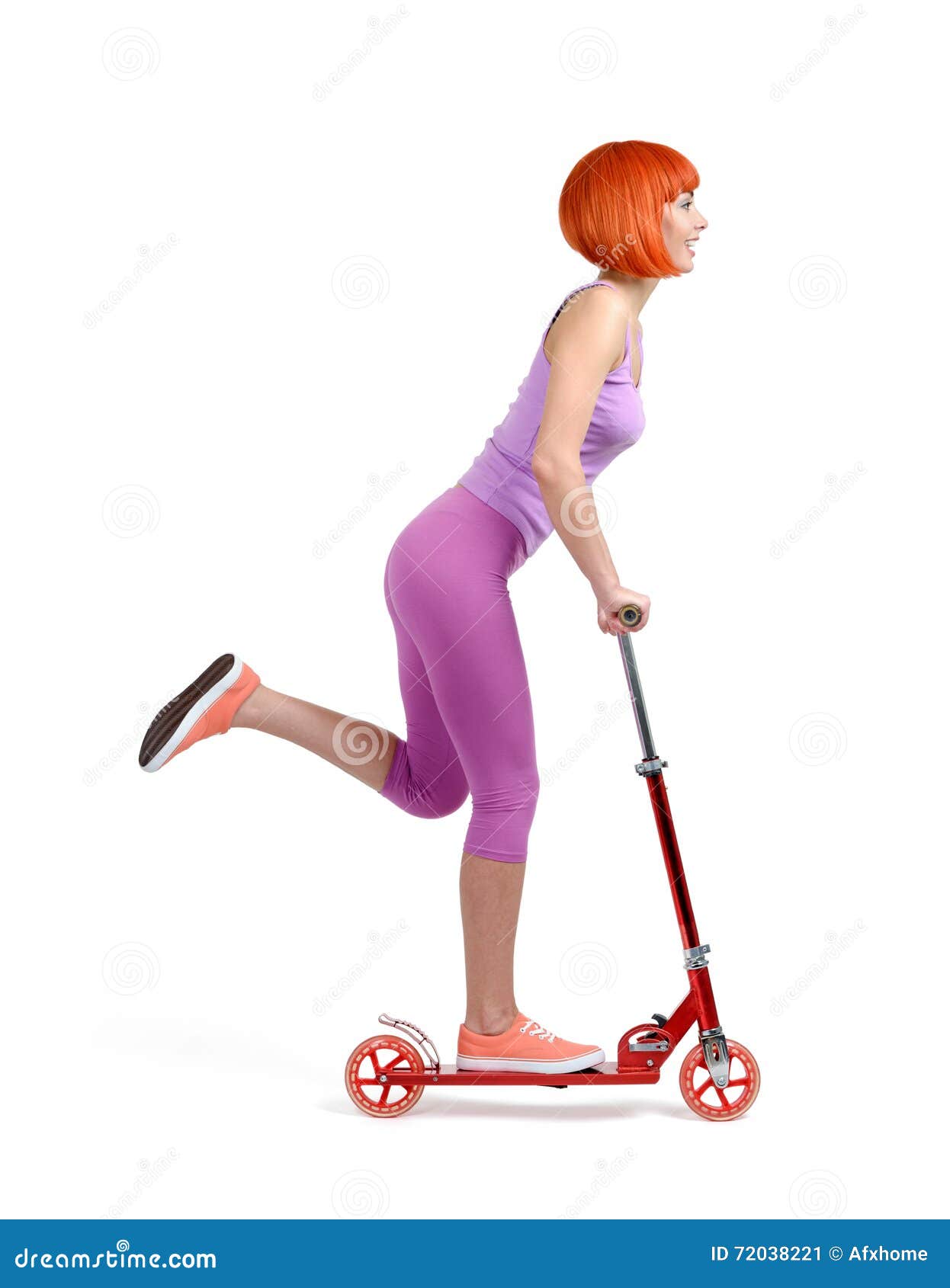 Young Girl on a Skateboard Scooter on White Background Stock Image