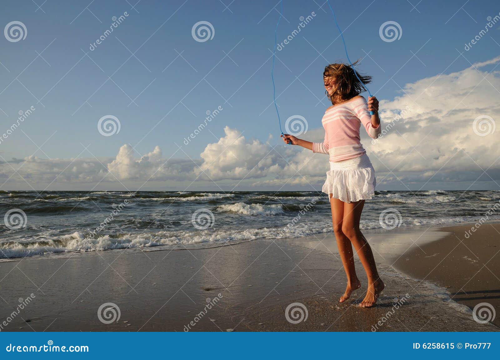 Young Girl Skipping on the Beach Stock Image Image of person, jump