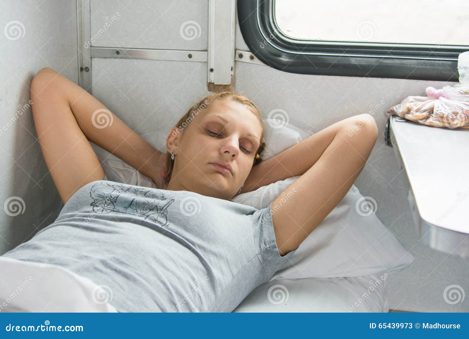 young-girl-sleeping-train-bottom-shelf-second-class-carriage-65439973.jpg