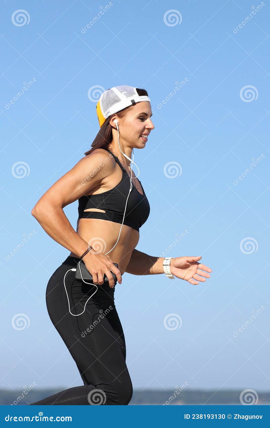 young woman jogging by the sea